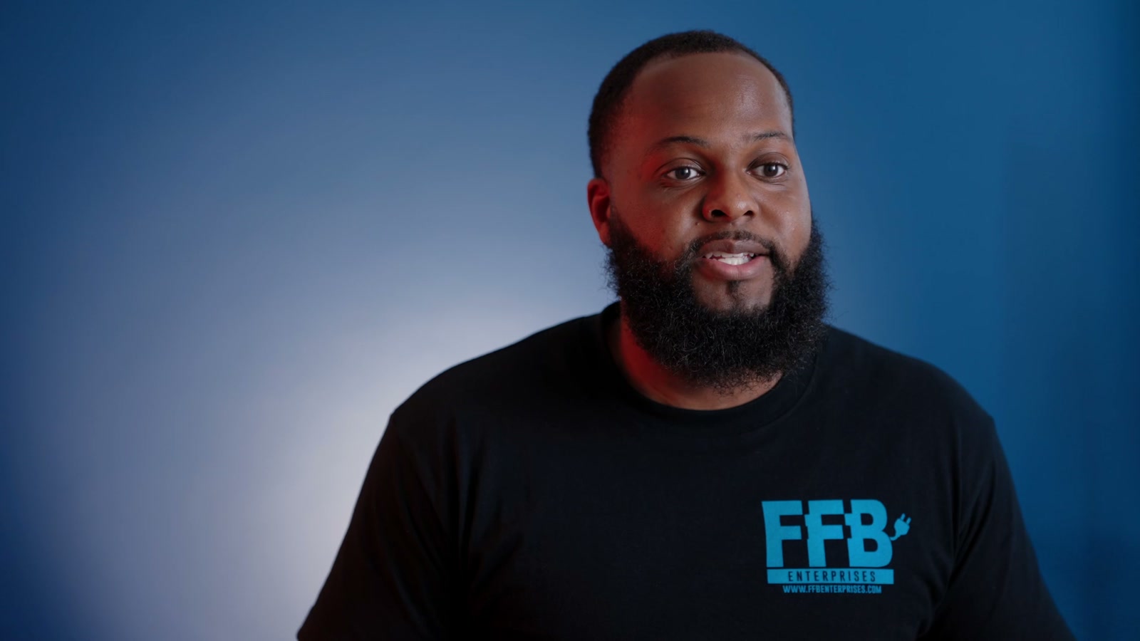 DeAngelo Watson of FFB Enterprises against a blue studio backdrop