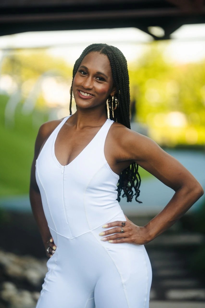 Jasmine Neely smiling in a white outfit