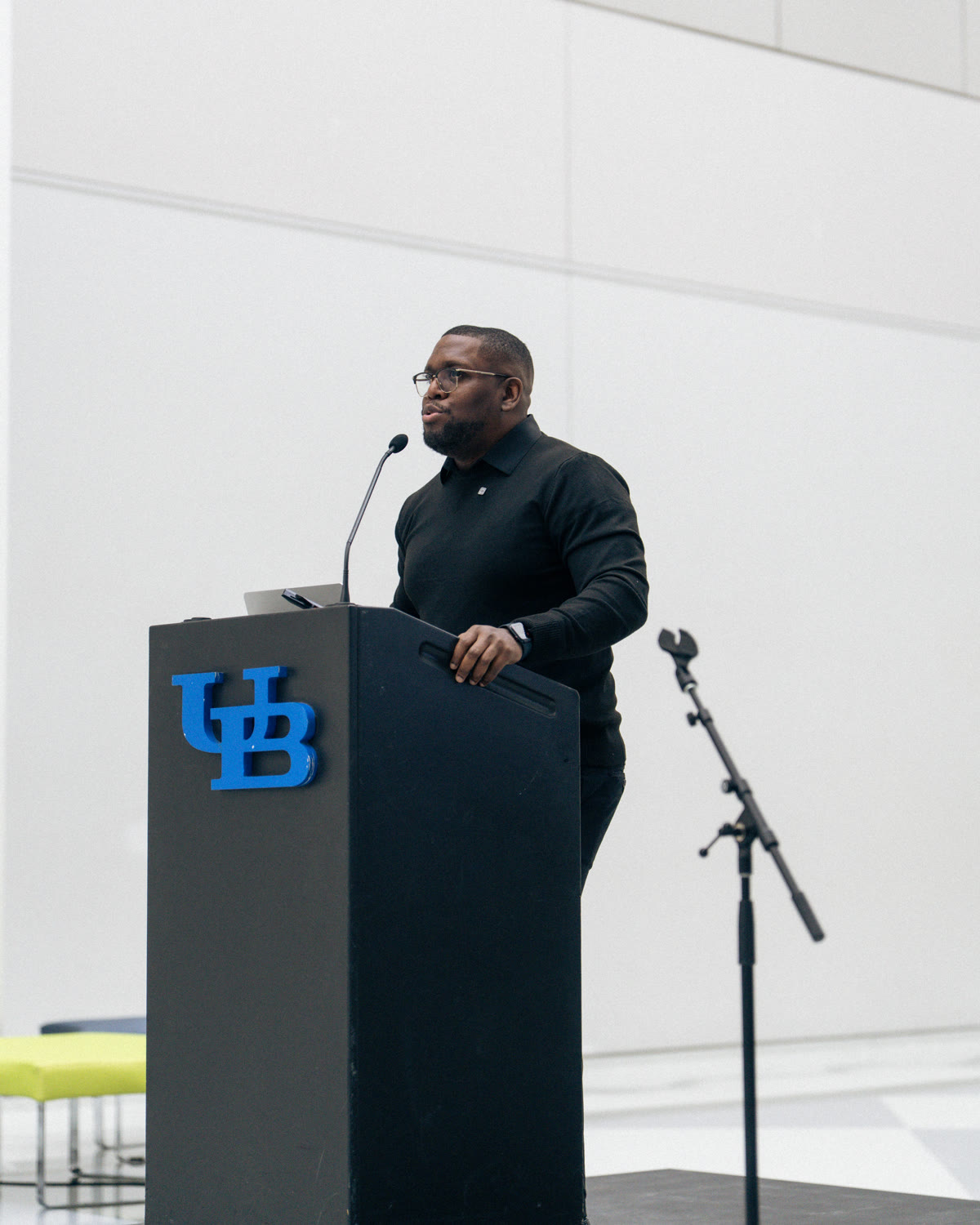 Technology founder presenting to an audience from a podium